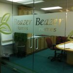 Etched vinyl glass graphics by Sign Central,Inc.